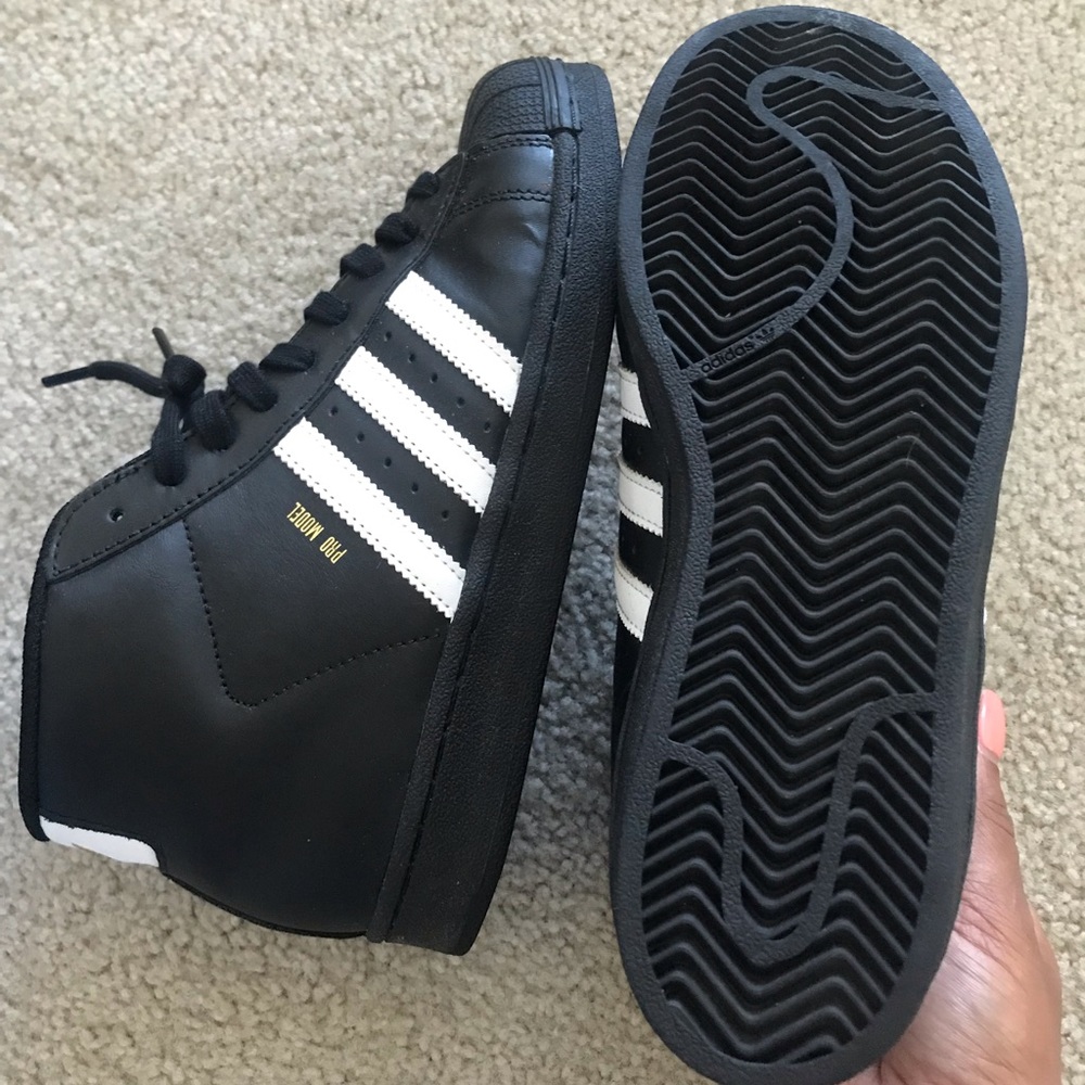 High top adidas shell toe sneakers